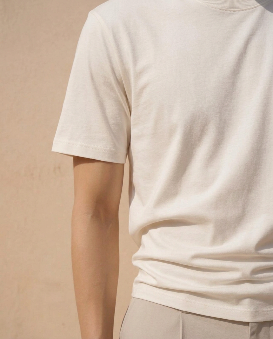 Low-profile hem falling over tailored trousers